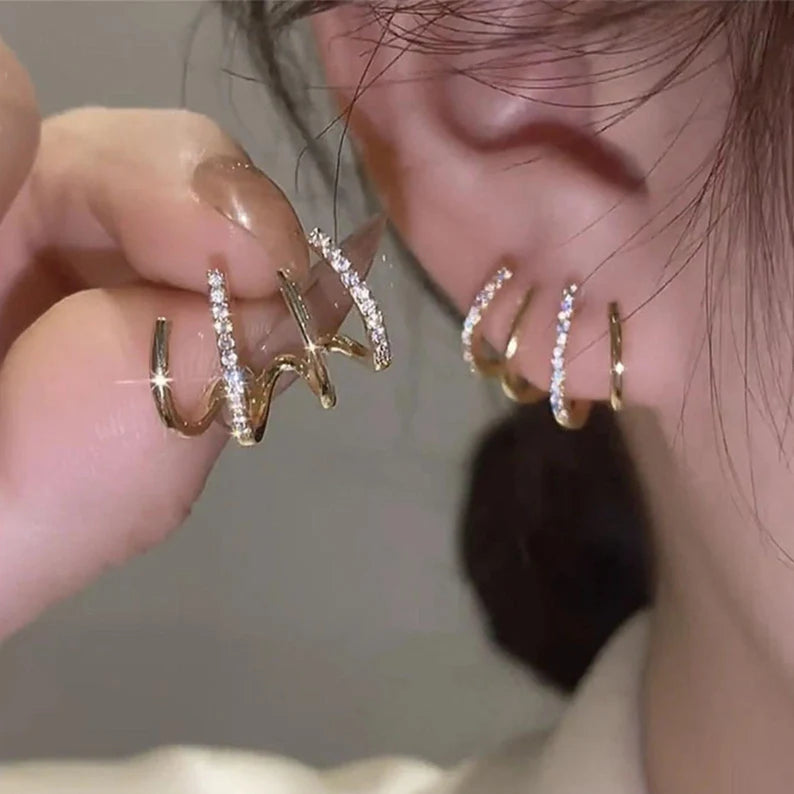 Gold online claw earrings